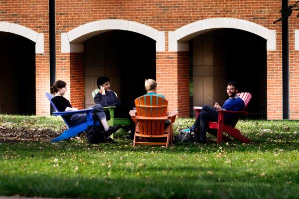 student photo grads in lawn chairs