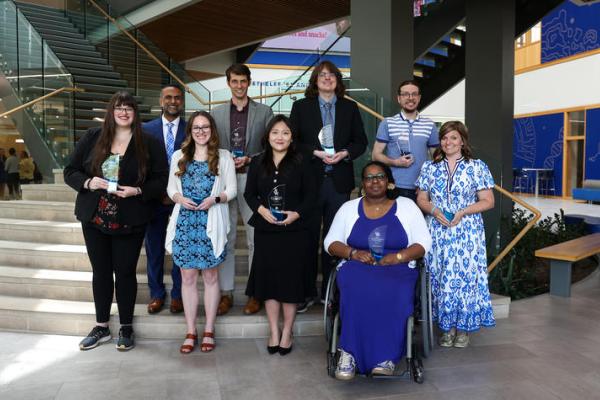 outstanding teaching awardees with trophies