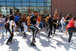 students dancing outside