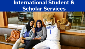 international student and scholar services students with uk mascot smiling