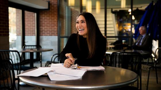 woman at table smile