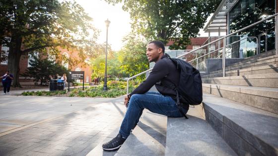 student outside on steps