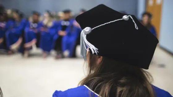 doctoral student at commencement ceremony 