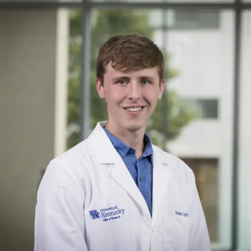 IMAGE: Isaac Huffman - college of pharmacy student in white lab coat