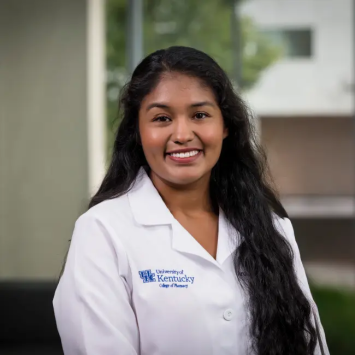 IMAGE: Medina, student, college of pharmacy white lab coat