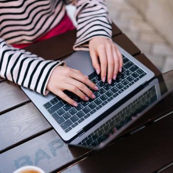IMAGE: student typing on keyboard